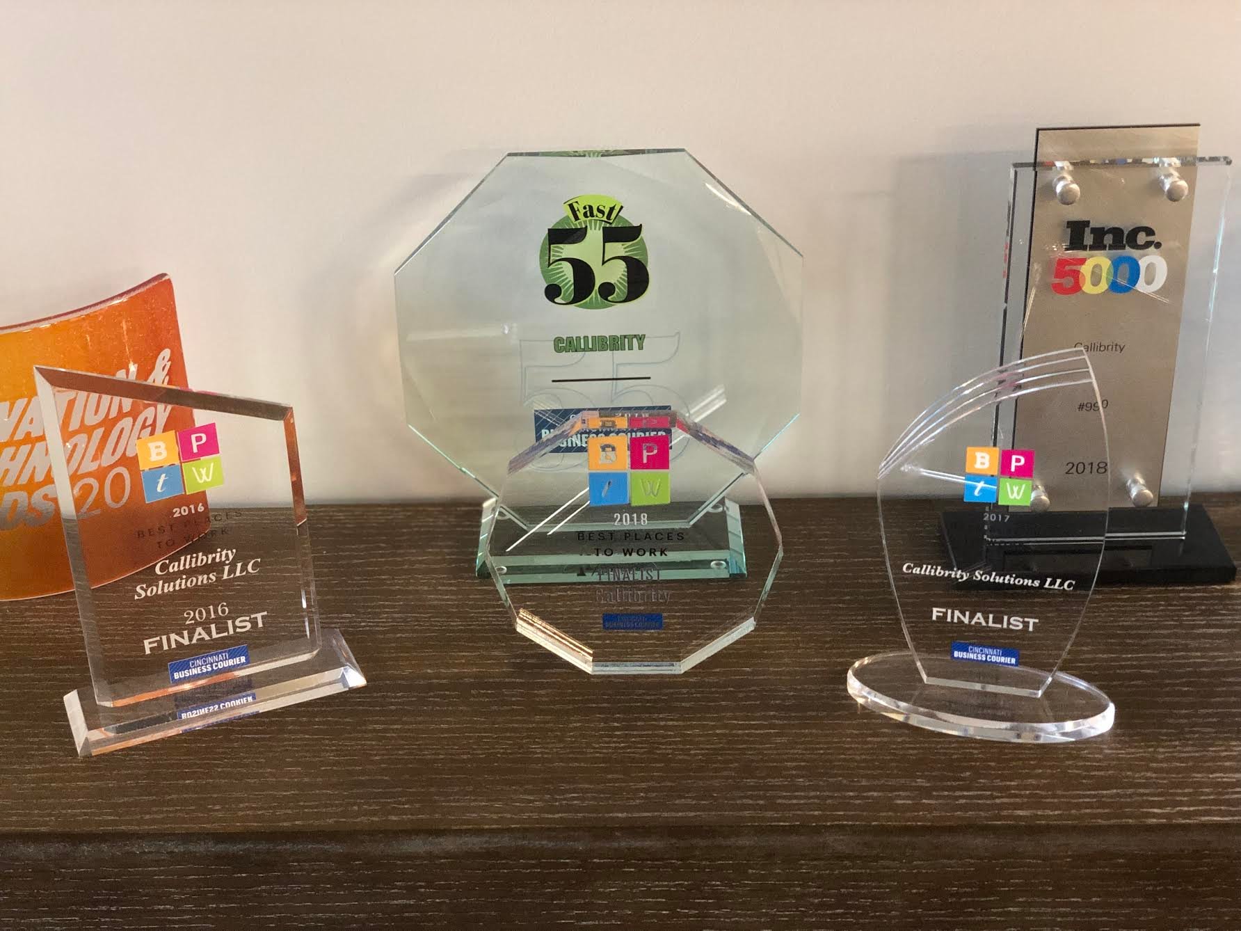 A collection of awards and accolades earned by Callibrity, including: Best Places to Work Finalist in 2016, 2017, and 2018; Fast 55; and Inc. 5000, 2018, placing at #950