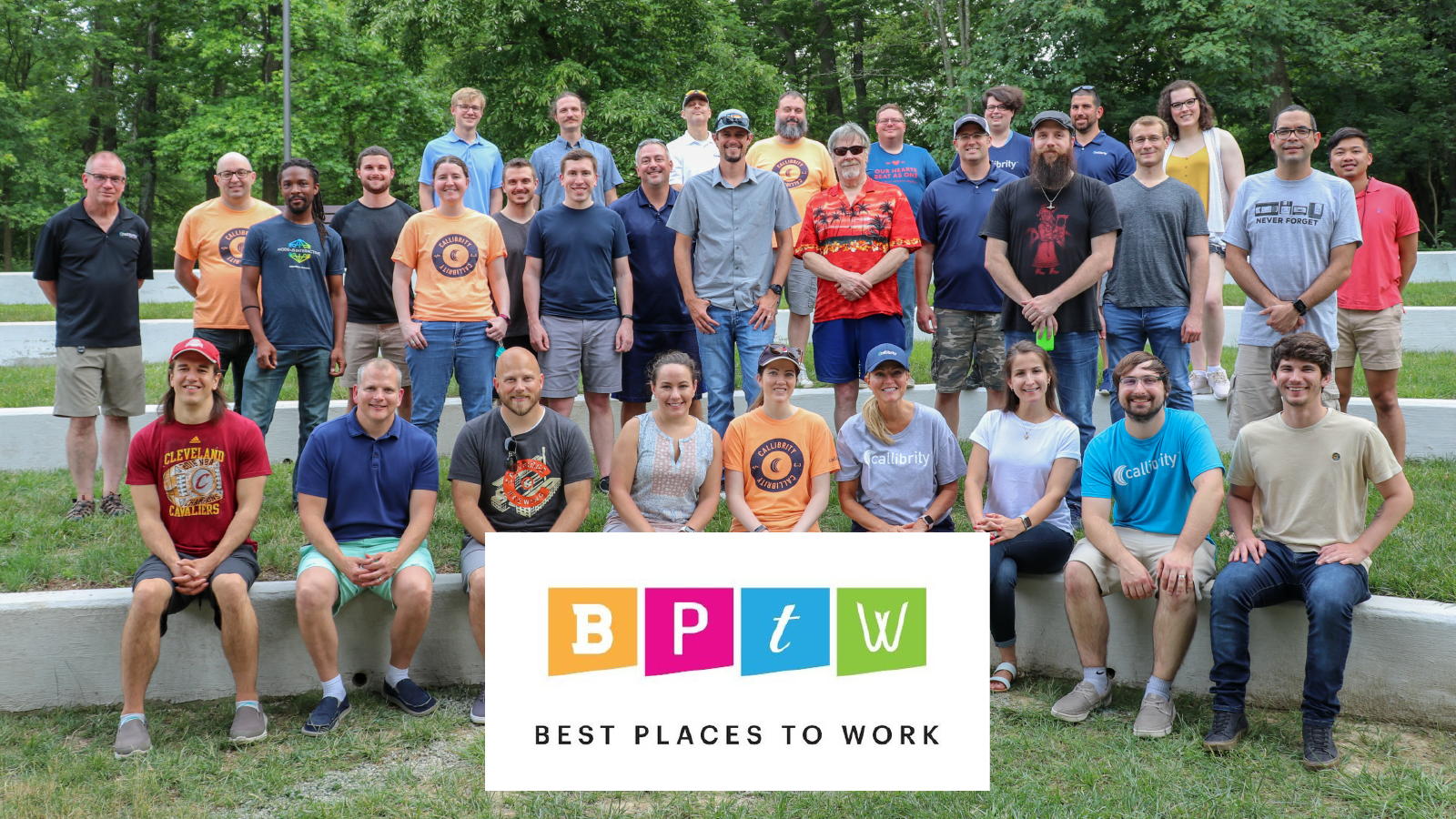 Our Team in 2021, a small company of under 40 people. The ‘Best Places to Work’ Logo is superimposed below the team.